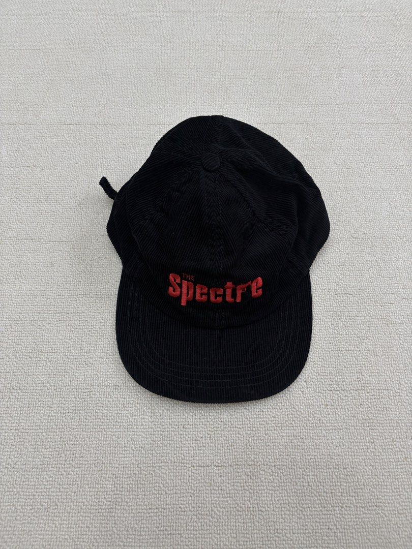 The Spectre Black Corduroy Baseball Cap (Category: Caps & Hats) located in Manila. Submitted by porma.market (Listing ID 1467403749, Image 2). Description: - Color & Material: Premium black corduroy with a clean structure - Design: Bold red 'THE Spectre' embroidery with a unique gun graphic inside the letter 'r' - Fit: Comfortable fit with an adjustable metal strapback closure - Details: Includes inner lining and authentic branded tags - Conditio