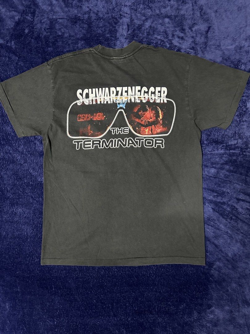 The Terminator t-shirt featuring Arnold Schwarzenegger (Category: Tshirts & Polo Shirts ) located in Quezon City. Submitted by rackculture (Listing ID 1467473116, Image 2). Description: 👕 Size Large 21.5 width 28.5 length 🧵Single Stitch All the Way 🏷️ TULTEX on Tag ₱ 1,500 only 📩 Message us to order.