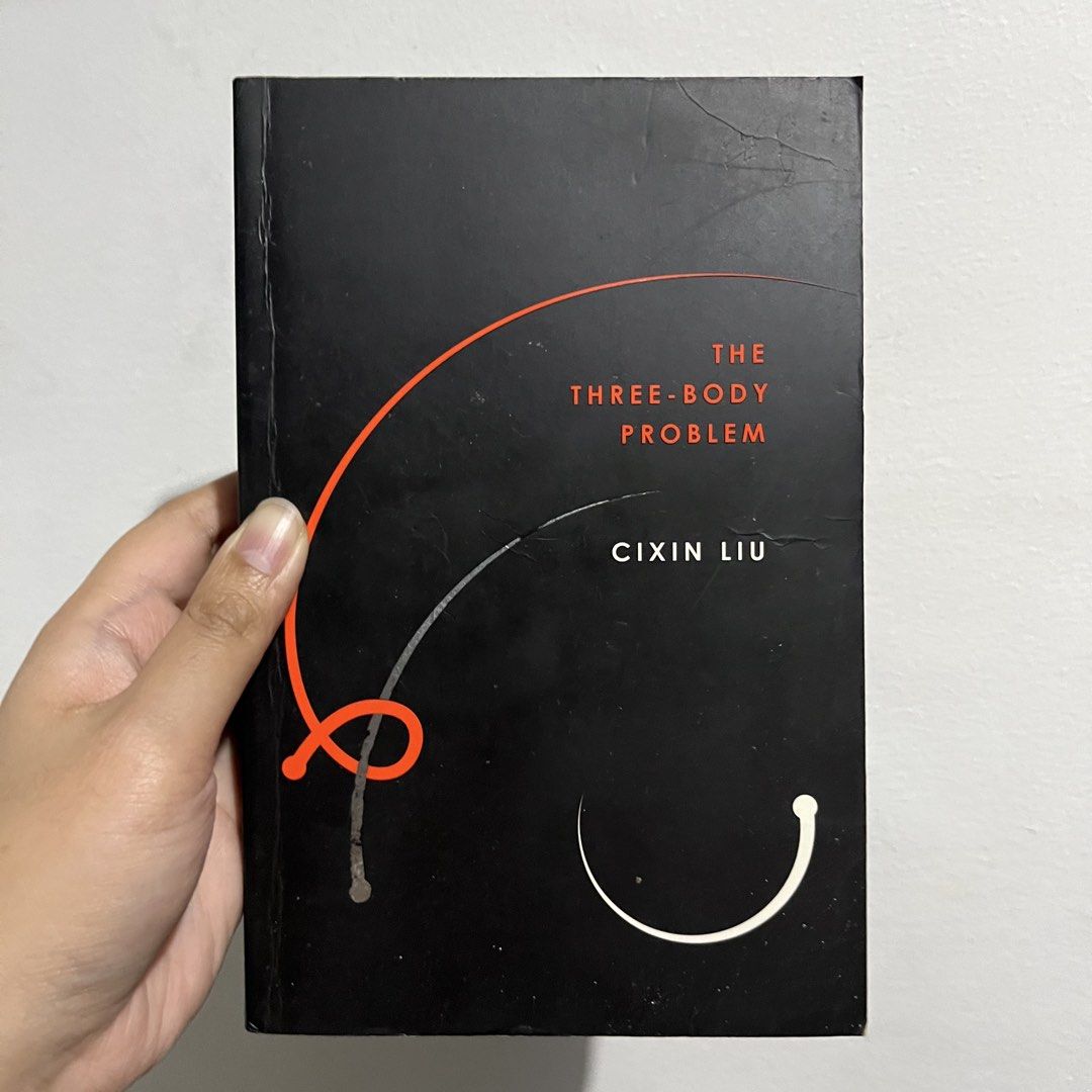 The Three-Body Problem by Cixin Liu Paperback (Category: Storybooks) located in Makati City. Submitted by binteji (Listing ID 1467440717, Image 1). Description: - Title: Sci-fi novel by Cixin Liu (Translated by Ken Liu) - Format: Paperback - Condition: Noticeable yellowing and foxing on page edges due to age/storage; minor creases and wear on the cover and spine.