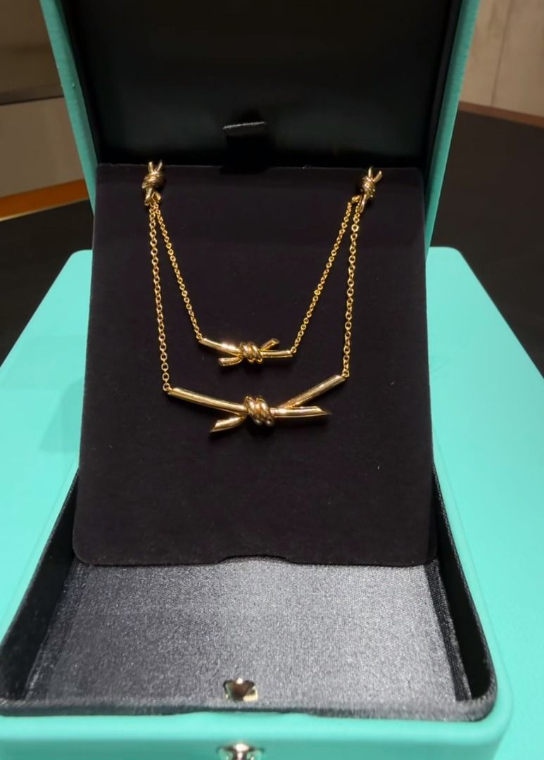 tiff gold knot necklace (Category: Necklaces) located in Quezon City. Submitted by japanandsingaporeluxepreloved (Listing ID 1467366837, Image 1). Description: .