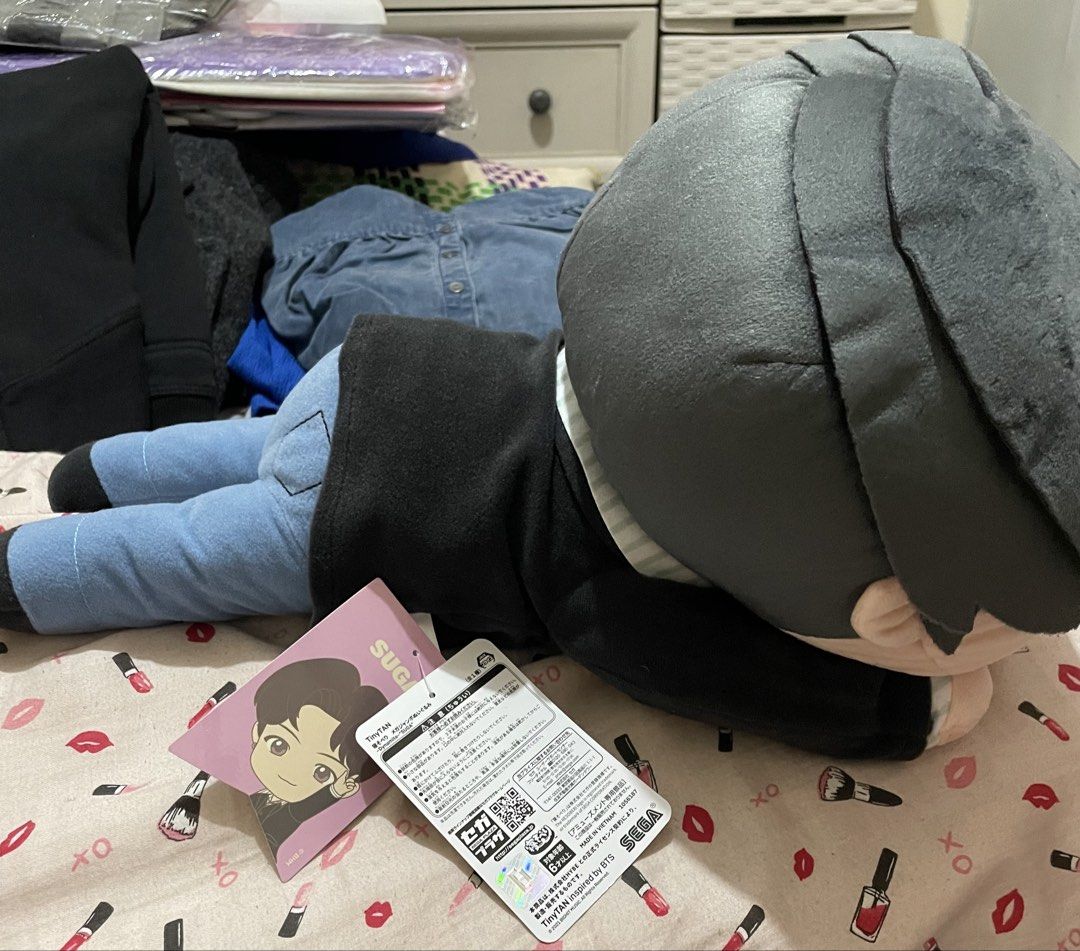 TinyTAN Suga Dynamite Mega Jumbo Plush Toy SEGA (Category: Plushies & Soft Toys) located in Quezon City. Submitted by stuffsrus (Listing ID 1467429241, Image 2). Description: Suga plush toy from the TinyTAN Dynamite collection by SEGA. Lying down pose wearing black jacket and blue jeans. Official tag attached with character illustration. Soft fabric, grey parted hair, embroidered facial features. Great collectible piece for BTS fans. Clean condit