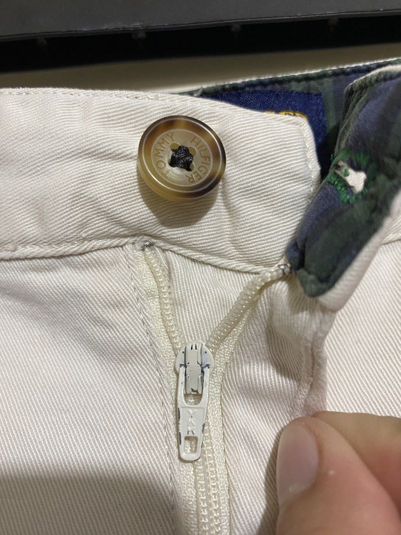 TOMMY HILFIGER, Golf chino shorts (Category: Shorts) located in Cavite. Submitted by jc_thrift95 (Listing ID 1467364621, Image 3). Description: - a pair of vintage cream or off-white Tommy Hilfiger Golf cotton chino shorts featuring a small embroidered emblem on the right back pocket area. - Made in Mauritius - L- 21 inch - W- 18 inch - Color rate 8/10 - See picture details for dimes..