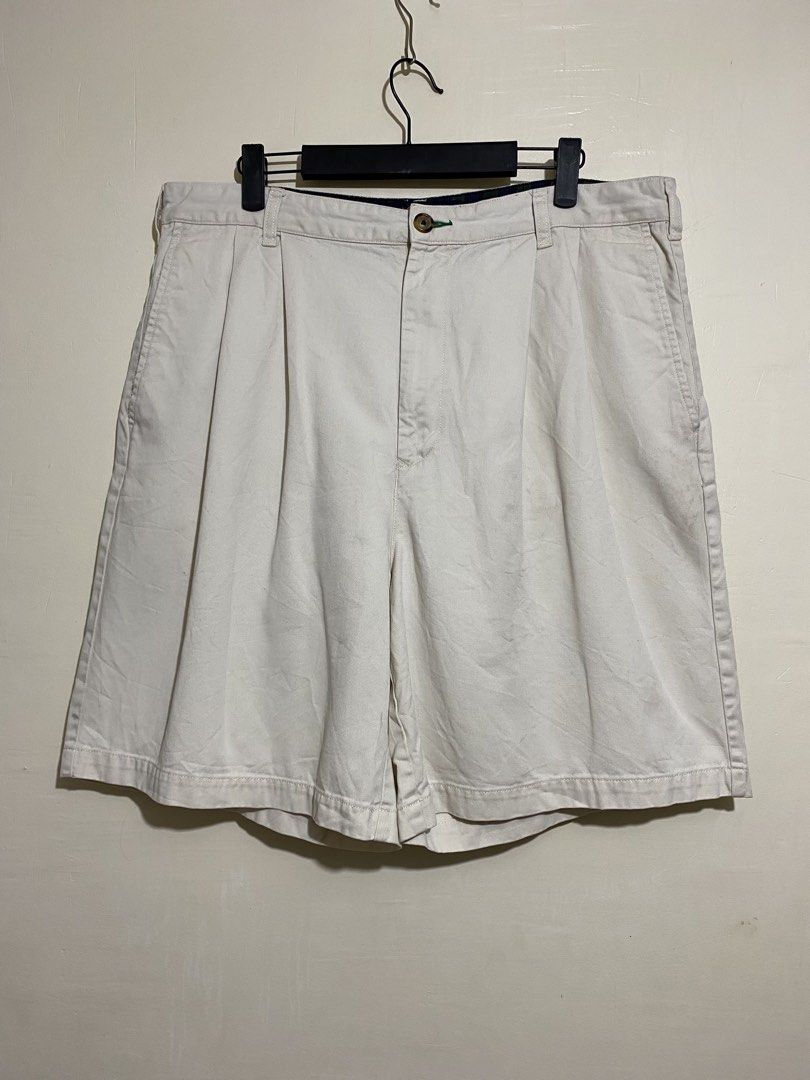 TOMMY HILFIGER, Golf chino shorts (Category: Shorts) located in Cavite. Submitted by jc_thrift95 (Listing ID 1467364621, Image 1). Description: - a pair of vintage cream or off-white Tommy Hilfiger Golf cotton chino shorts featuring a small embroidered emblem on the right back pocket area. - Made in Mauritius - L- 21 inch - W- 18 inch - Color rate 8/10 - See picture details for dimes..