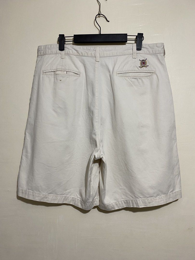 TOMMY HILFIGER, Golf chino shorts (Category: Shorts) located in Cavite. Submitted by jc_thrift95 (Listing ID 1467364621, Image 2). Description: - a pair of vintage cream or off-white Tommy Hilfiger Golf cotton chino shorts featuring a small embroidered emblem on the right back pocket area. - Made in Mauritius - L- 21 inch - W- 18 inch - Color rate 8/10 - See picture details for dimes..