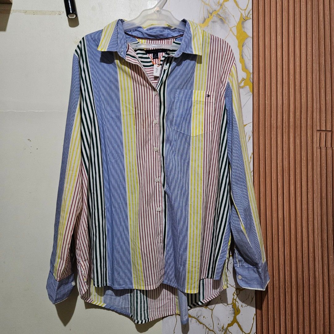 Tommy Hilfiger multicolor vertical stripe button-down shirt unisex large (Category: Tshirts & Polo Shirts ) located in Digos. Submitted by marianfinds (Listing ID 1467524195, Image 2). Description: large on tag ♡Authentic/preloved item. Actual photos posted. Please check all photos and details carefully before purchasing. Minor signs of use may be present. 📌Please manage your expectations this is not brandnew ●Color may vary due to lighting Walk