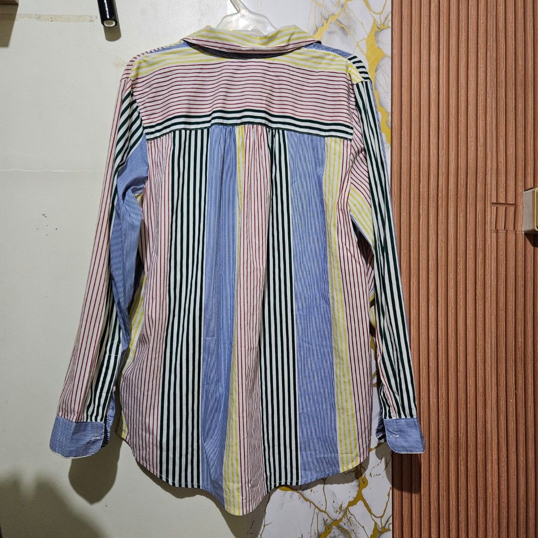 Tommy Hilfiger multicolor vertical stripe button-down shirt unisex large (Category: Tshirts & Polo Shirts ) located in Digos. Submitted by marianfinds (Listing ID 1467524195, Image 3). Description: large on tag ♡Authentic/preloved item. Actual photos posted. Please check all photos and details carefully before purchasing. Minor signs of use may be present. 📌Please manage your expectations this is not brandnew ●Color may vary due to lighting Walk