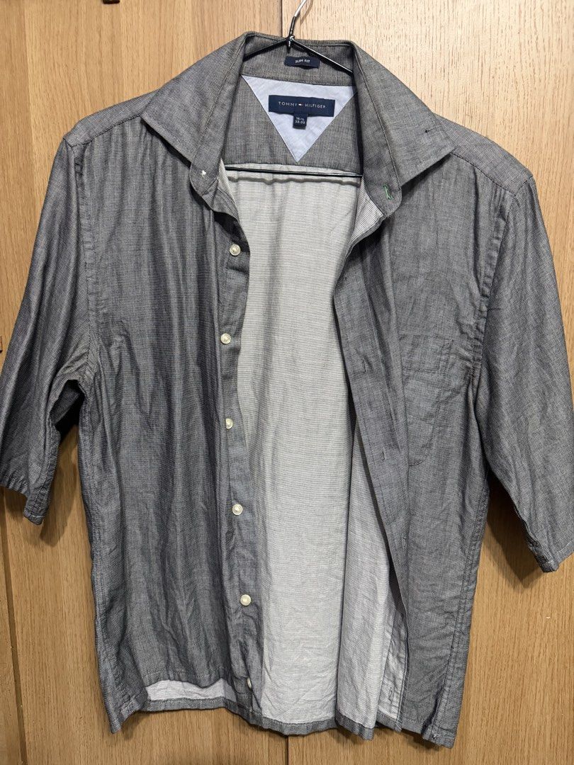 Tommy Hilfiger Slim Fit Grey Button Down Shirt (Category: Formal Shirts) located in Manila. Submitted by marclouiea70819 (Listing ID 1467560435, Image 1). Description: - Brand: Tommy Hilfiger - Color: Grey with micro texture pattern - Fit: Slim fit - Size: 14.5 (Sleeve length: 32-33) - Details: Classic collar, left chest pocket, button-down closure - Material: Lightweight, perfect for office or smart casual wear - Condition: Clean and well-mainta