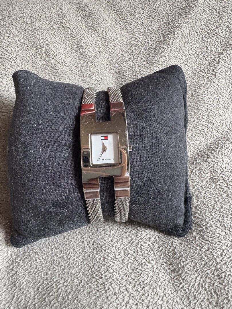 Tommy Hilfiger The Westport (Category: Luxury Watches) located in Muntinlupa City. Submitted by felma31 (Listing ID 1467447063, Image 2). Description: Features a distinctive polished silver-tone cuff case with a split/twin stainless steel mesh band and a rectangular white dial bearing the iconic Tommy Hilfiger flag logo..