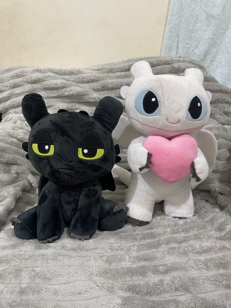 Toothless & Light Fury Bundle (Category: Plushies & Soft Toys) located in Molave. Submitted by thrifthauls (Listing ID 1467494664, Image 1). Description: Good as new Needs cleaning lang 10inches and 12inches tall Bundle 680 shipped Courier: JNT.