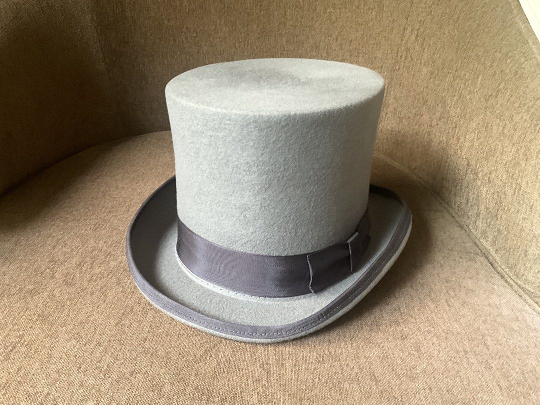 Top Hat Gray Size 61 (Category: Activewear) located in Quezon City. Submitted by dorek_888 (Listing ID 1467582333, Image 2). Description: - Material: Premium felt - Color: Classic grey with dark grey ribbon band - Design: Curved brim with matching trim and clean structured shape - Interior: White fabric lining and black leather sweatband with stamped size markings - Condition: Clean and solid construction.