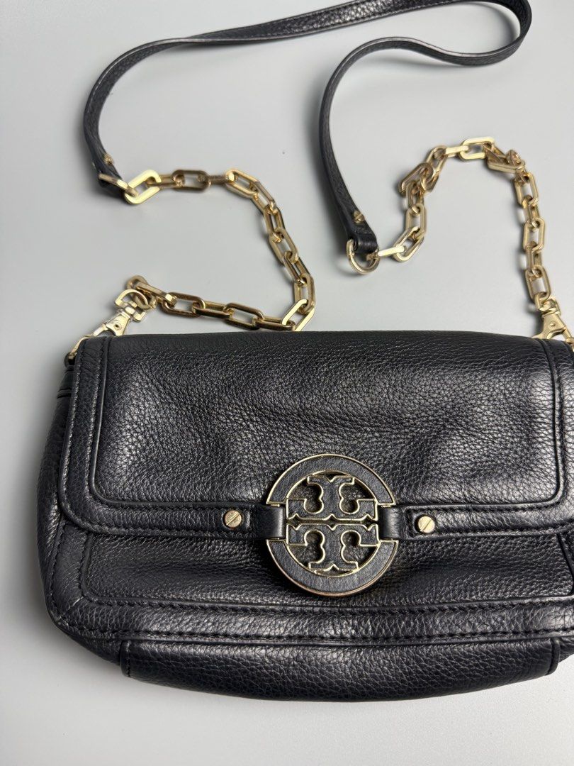Tory Burch Amanda Chain Crossbody Bag (Category: Luxury Bags & Wallets) located in Manila. Submitted by limsanity03 (Listing ID 1467487419, Image 2). Description: - Brand: Tory Burch - Material: Premium black pebble leather - Hardware: Gold-tone chain link and leather strap - Closure: Front flap with secure round logo clasp and magnetic snap - Interior: Dark fabric lining with minimal signs of use - Size: Compact, perfect for daily essentials - C