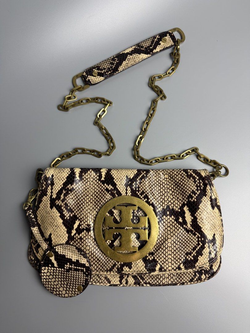 Tory Burch Audra Reva Shoulder Bag (Category: Luxury Bags & Wallets) located in Manila. Submitted by limsanity03 (Listing ID 1467488642, Image 1). Description: - Brand: Tory Burch - Material: Python print leather in neutral cream and brown - Hardware: Antique brass with signature T logo on front flap - Strap: Chain and leather shoulder strap - Inclusion: Matching round pouch - Interior: Fabric lining with zip pocket and branded metal pull - Condi