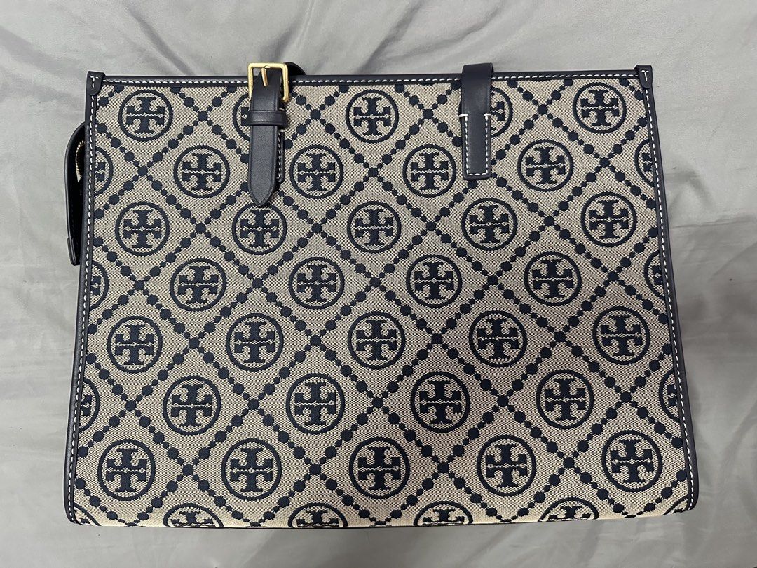 Tory Burch Monogram Jacquard Tote Bag Navy Blue (Category: Tote Bags) located in Quezon City. Submitted by brilliantchesca (Listing ID 1467478818, Image 2). Description: 20k or best offer Brand new with tags attached and original stuffing intact, 100% clean inside and out Got it thinking I wanted a big work bag. Got it 2024 for 40+k - Material: Navy blue monogram jacquard fabric with tan suede interior - Hardware: Gold-tone - Handles: Leather wit