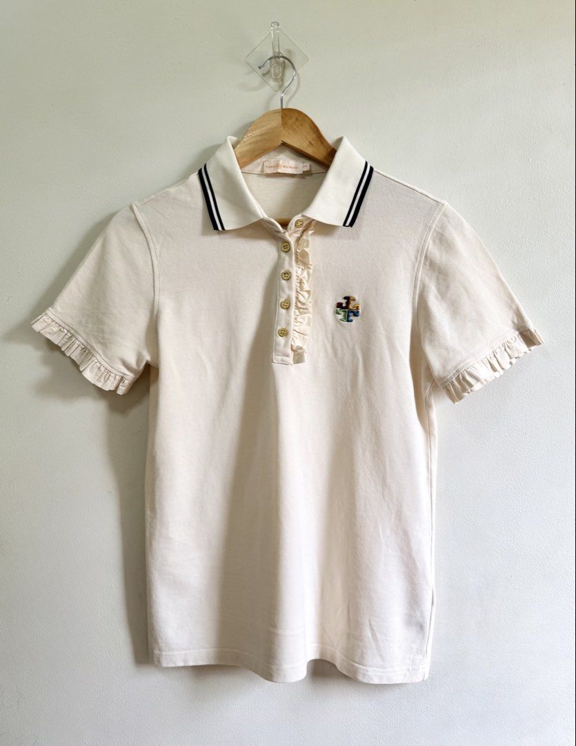 Tory Burch polo shirt (Category: Blouses) located in Tarlac. Submitted by giannisdeclutters4106 (Listing ID 1467474790, Image 1). Description: Like new Cream color Medium on tag .