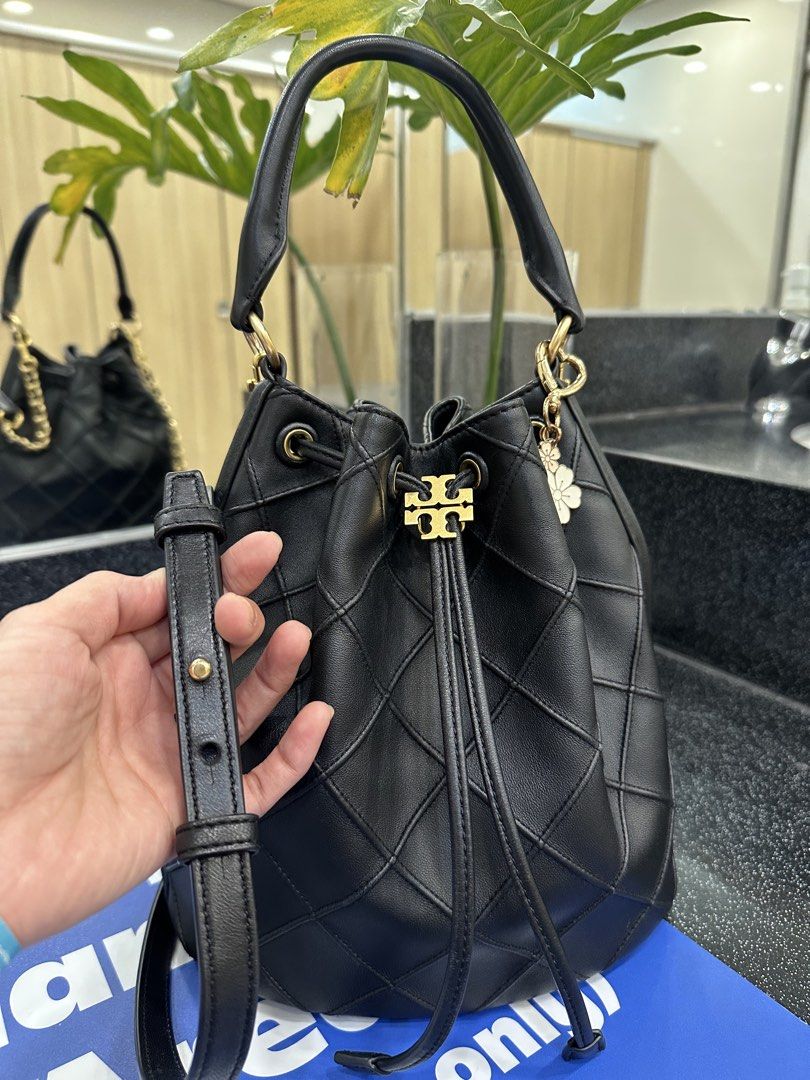 Tory Burch Quilted Black Leather Bucket Bag (Category: Luxury Bags & Wallets) located in Manila. Submitted by anniesam (Listing ID 1467417812, Image 3). Description: - flask sale today only 💯 guaranteed authentic Brand: Tory Burch - Style: Quilted leather bucket bag - Color: Classic Black with Gold-tone hardware - Features: Signature front logo emblem, secure drawstring closure, top handle, and adjustable shoulder strap - Interior: Spacious main