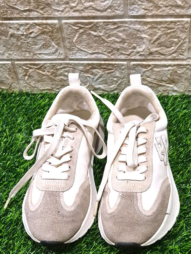 Tory Burch Sneakers Beige Suede Leather (Category: Sneakers) located in Antipolo. Submitted by saribymonica (Listing ID 1461116967, Image 2). Description: - Stylish Tory Burch sneakers in a versatile beige and cream colorway. - Crafted with a mix of premium suede and leather panels. - Classic lace-up design with signature branded aglets. - Comfortable chunky sole for all-day wear. - Ideal for elevating your casual Minor flaws: Slightly thin heel 