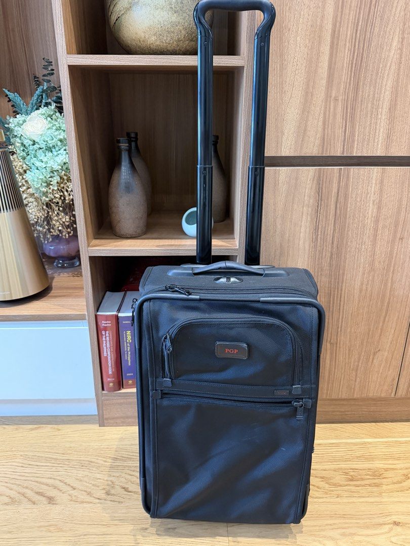 TUMI Black Rolling Carry-On Luggage Suitcase with Monogram PGP (Category: Luggage) located in Del Monte. Submitted by pgp1989 (Listing ID 1467393883, Image 1). Description: Price: ₱8,000 (Negotiable) Selling my authentic TUMI Alpha 2-Wheel Carry-On Luggage in classic black ballistic nylon. Features: * Premium, durable TUMI ballistic nylon construction * Expandable main compartment for additional packing space * Multiple front zippered compartment