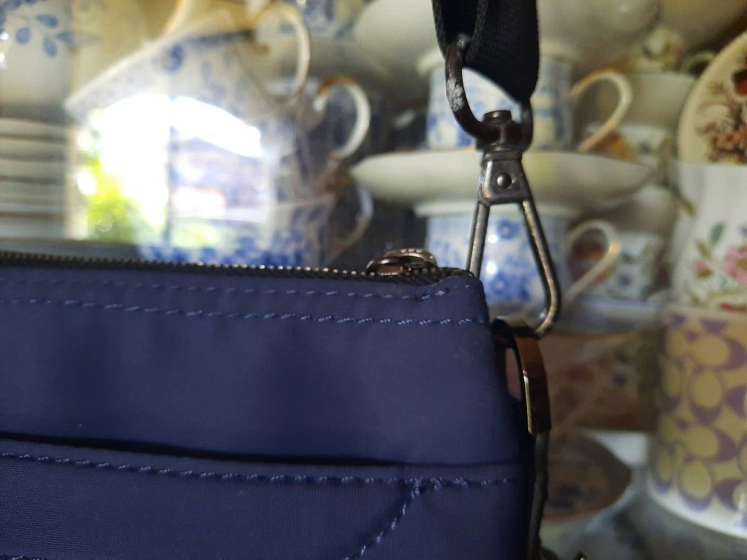 Tumi Blue Nylon Crossbody Bag (Category: Luxury Bags & Wallets) located in Manila. Submitted by boldfire_315559 (Listing ID 1467381841, Image 3). Description: - Authentic Tumi crossbody bag in stylish blue nylon - Accented with premium black leather and includes matching luggage tag - Secure zip top closure with clean exterior and interior fabric - Interior equipped with handy slip pockets and Tumi tracer metal plate - Features an adjustable stra