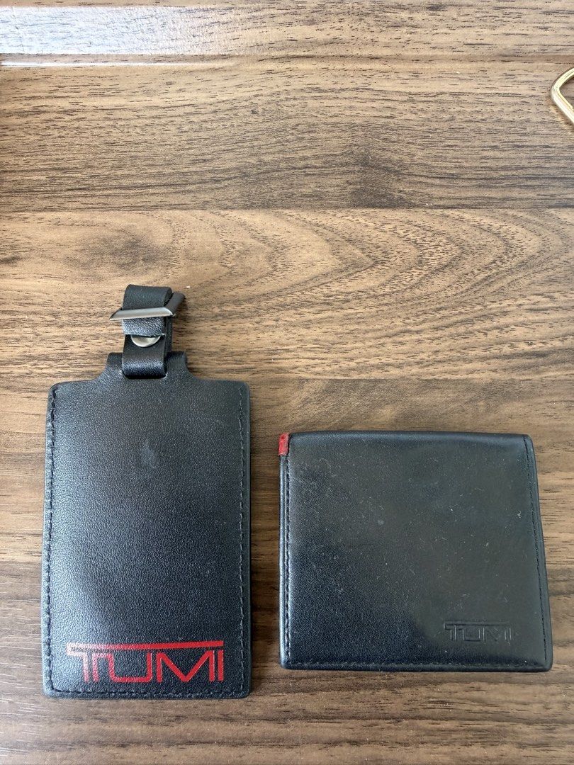 Tumi Leather Wallet and Luggage Tag Set (Category: Wallets & Card Holders) located in Digos. Submitted by old_soul. (Listing ID 1467396479, Image 1). Description: Travelers know the feeling of things made to last. Vintage Tumi leather accessories featuring that classic retro red logo. Durable, functional, and full of quiet utility. ✈️ Tumi leather wallet and matching luggage tag. Black leather build with red Tumi branding on the tag. Wallet opens