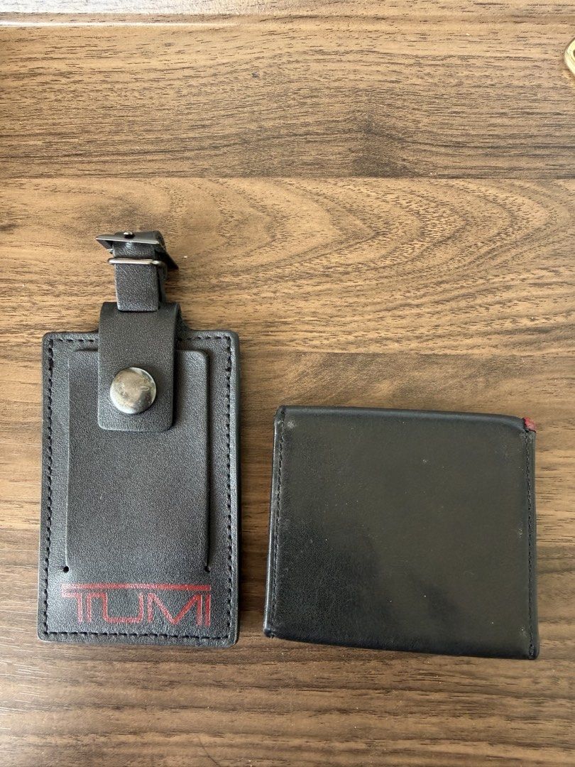 Tumi Leather Wallet and Luggage Tag Set (Category: Wallets & Card Holders) located in Digos. Submitted by old_soul. (Listing ID 1467396479, Image 2). Description: Travelers know the feeling of things made to last. Vintage Tumi leather accessories featuring that classic retro red logo. Durable, functional, and full of quiet utility. ✈️ Tumi leather wallet and matching luggage tag. Black leather build with red Tumi branding on the tag. Wallet opens