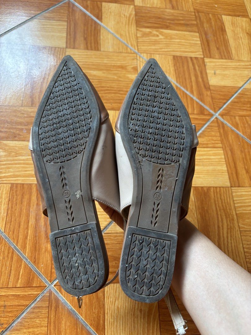 Two-tone Pointed Toe Slingback Flat Shoes Size 38 (Category: Flats & Sandals) located in Balayan. Submitted by authenticfindsbymrb (Listing ID 1467420309, Image 2). Description: - Style: Pointed toe slingback flats - Color: Two-tone brown and beige - Size: 38 (marked on sole) - Features: Adjustable ankle strap with metal buckle, low heel design - Sole: Textured rubber soles for extra grip - Condition: Gently worn outsoles with clean, well-maintai