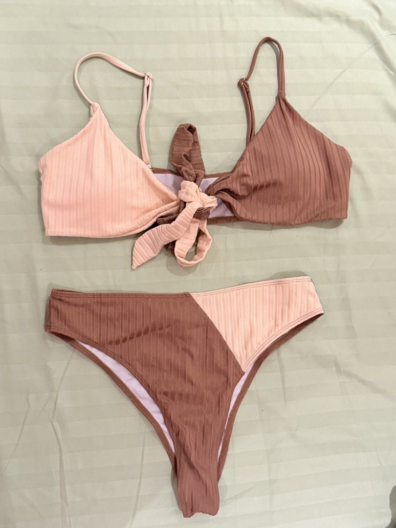 Two-tone ribbed bikini set in pink and brown (Category: Bikinis & Swimsuits) located in Quezon City. Submitted by caathhx_ (Listing ID 1467509759, Image 1). Description: - Style: Two-piece ribbed bikini set - Colorway: Chic pink and brown - Top Details: Adjustable straps with a cute front tie - Bottom Details: Trendy color-block diagonal split design - Comfort: Soft textured fabric with full lining.