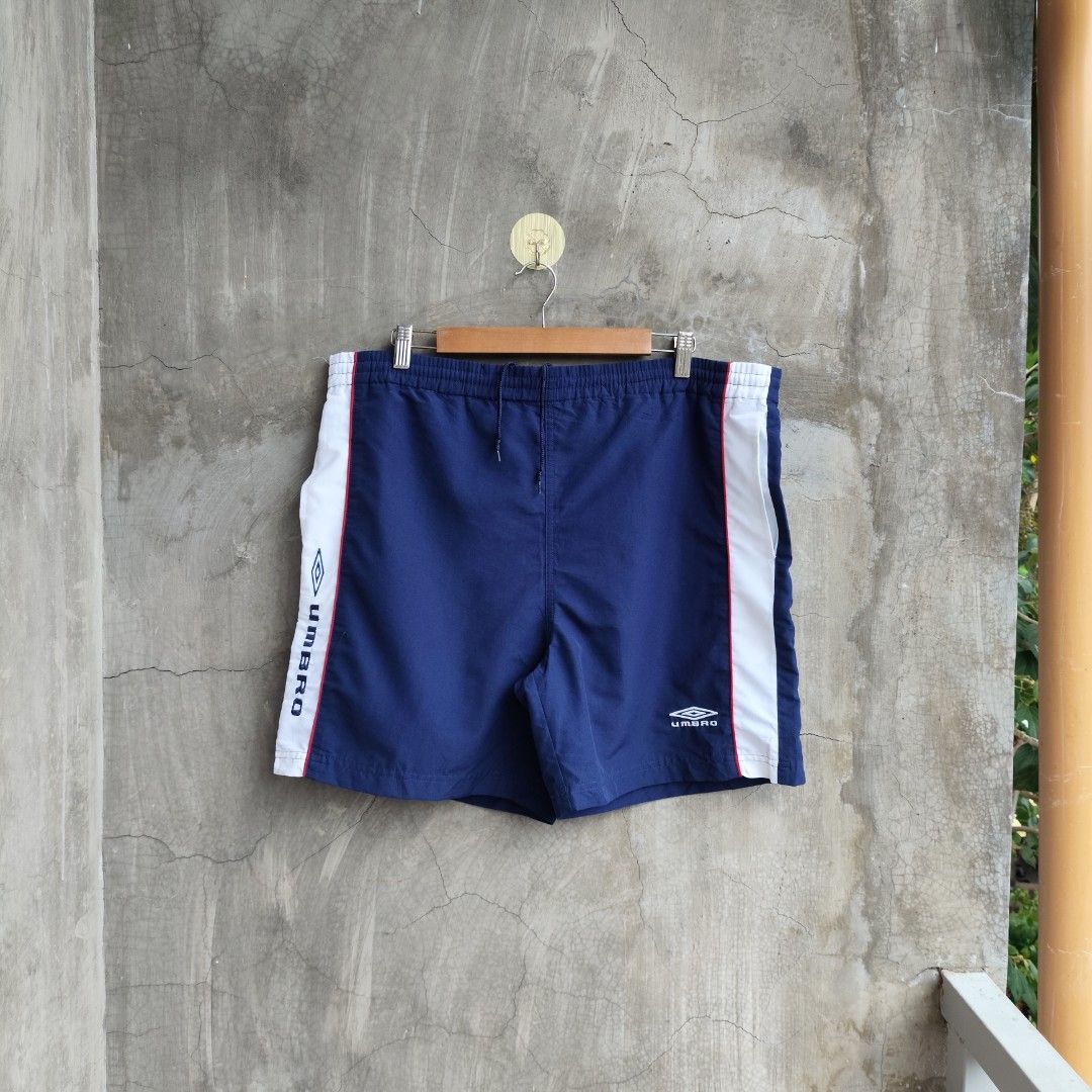 Umbro Nylon Shorts (Category: Shorts) located in Tayabas. Submitted by streetdept.ph (Listing ID 1467444013, Image 1). Description: Umbro Nylon Shorts Measurements (inches): Waist 38 (adjustable) Length 18 Leg opening 13.5 Size: Medium on tag Excellent condition No flaws .