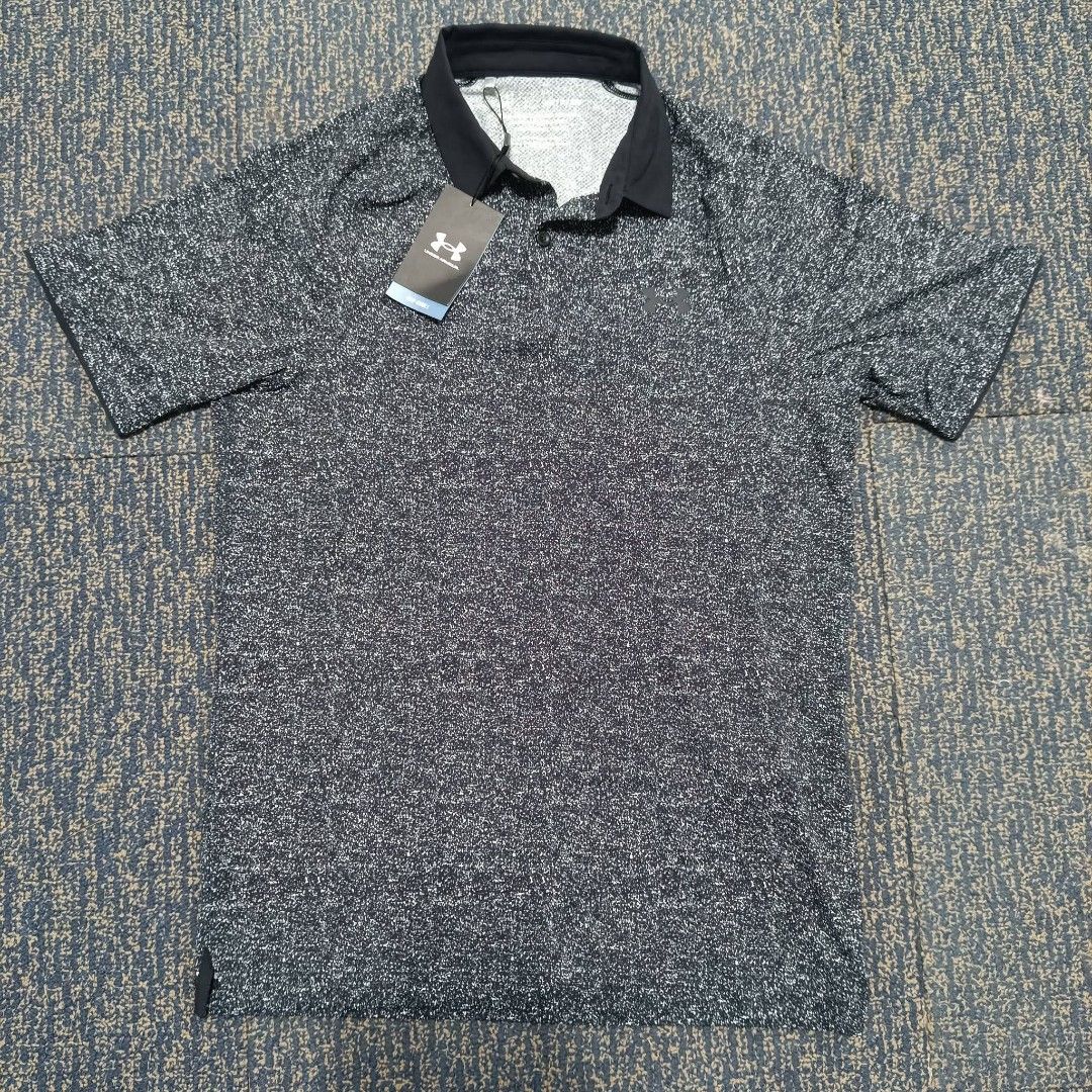 Under Armour (Category: Tshirts & Polo Shirts ) located in Angeles City. Submitted by thriftilious.ph (Listing ID 1467384951, Image 1). Description: - Brand: Under Armour - Item: Iso-Chill Polo Shirt - Condition: Brand new with original retail tags attached - Size: Men's SM (Small) - Fit: Loose fit for maximum comfort - Design: Black and white speckled pattern with solid black collar and button placket - Ideal for: Golf, sports, and everyday acti