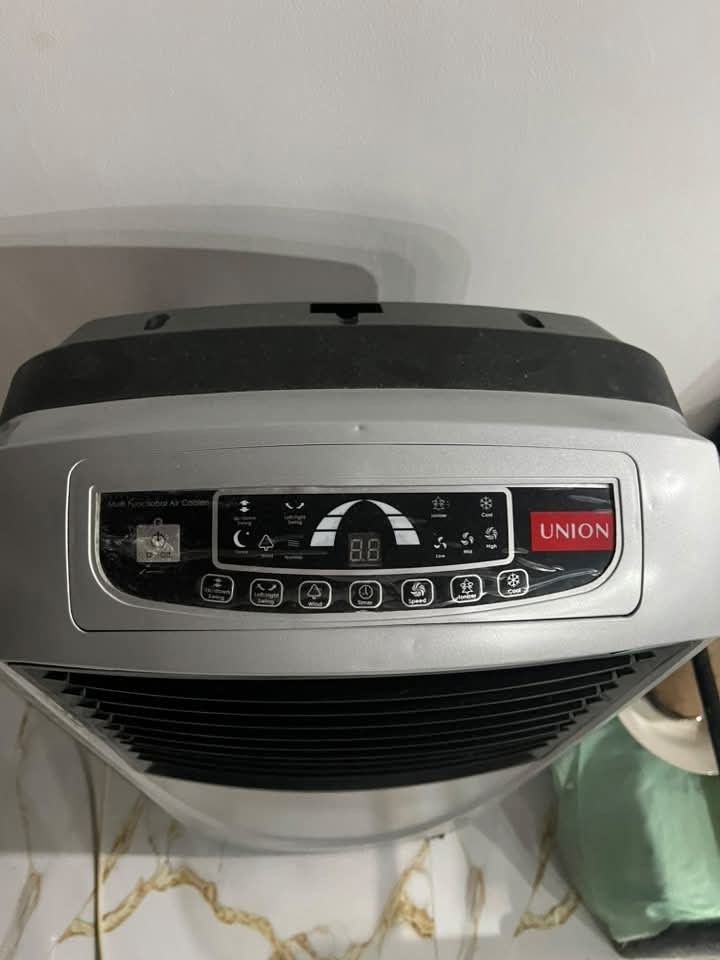 Union UGAC-001 20L Evaporative Air Cooler (Category: Air Conditioning and Heating) located in Quezon City. Submitted by silverforest_0cab92 (Listing ID 1467383078, Image 1). Description: - Brand/Model: Union Evaporative Air Cooler (UGAC-001) - Water Tank Capacity: Large 20 Liters - Power: 100W (230V, 60Hz) - Controls: Digital control panel with speed settings, timer, and swing modes - Cooling Feature: High-efficiency honeycomb cooling pads - Cond