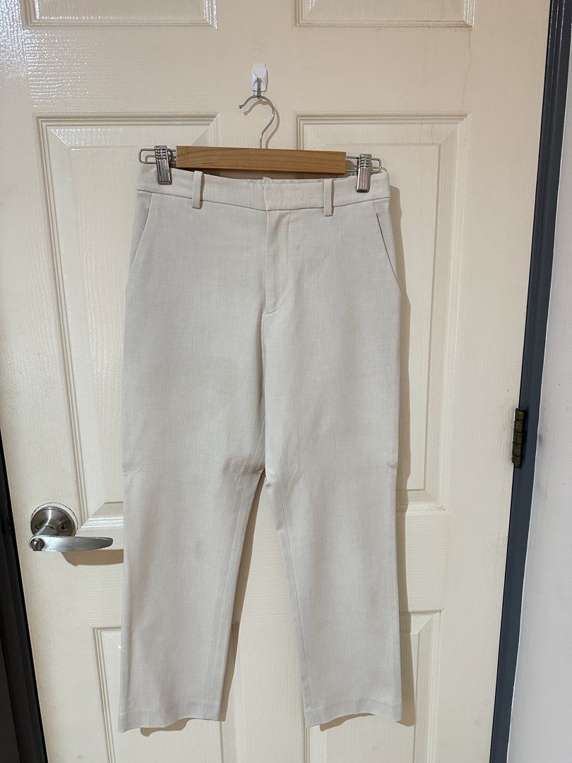 Uniqlo Beige Smart Ankle Pants Size S (Category: Trousers) located in Manila. Submitted by ktyyycloset (Listing ID 1467445084, Image 1). Description: - Brand/Item: Uniqlo Beige Ankle-Length Trousers - Size: S (Fits waist 60-66cm, hips 85-91cm) - Material: 68% polyester, 28% rayon, 4% spandex (super comfortable with stretch) - Design: Straight leg cut, clean cream color, belt loops, and dual back welt pockets - Style: Great staple piece for both o