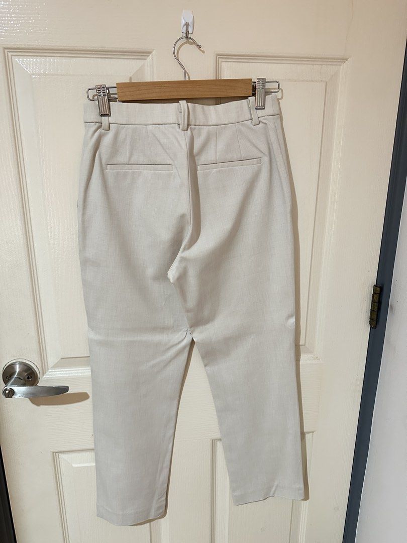 Uniqlo Beige Smart Ankle Pants Size S (Category: Trousers) located in Manila. Submitted by ktyyycloset (Listing ID 1467445084, Image 3). Description: - Brand/Item: Uniqlo Beige Ankle-Length Trousers - Size: S (Fits waist 60-66cm, hips 85-91cm) - Material: 68% polyester, 28% rayon, 4% spandex (super comfortable with stretch) - Design: Straight leg cut, clean cream color, belt loops, and dual back welt pockets - Style: Great staple piece for both o