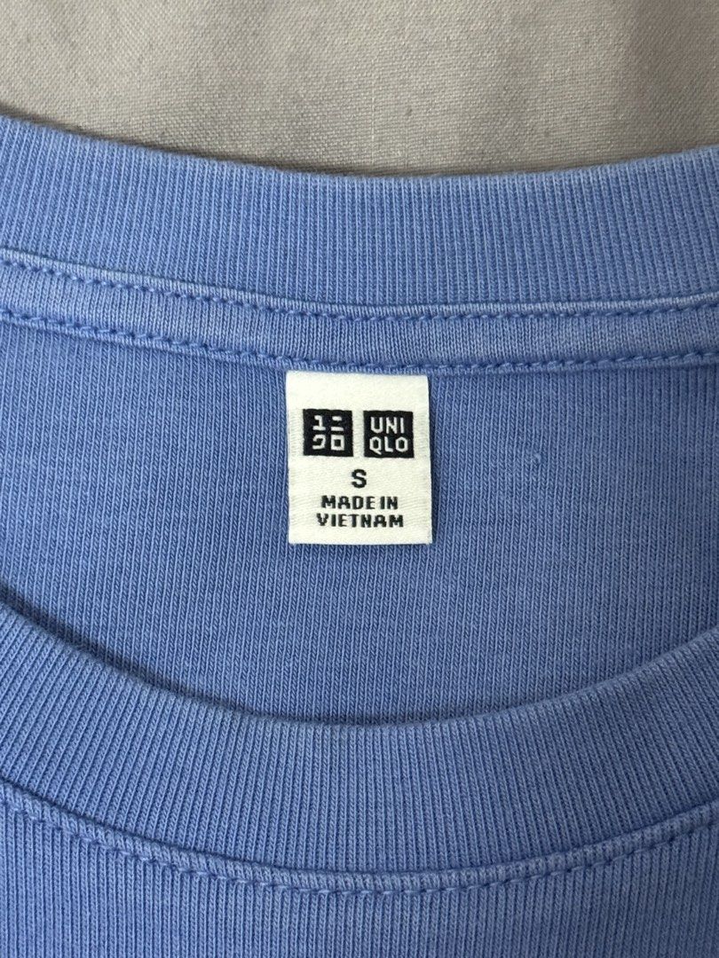 Uniqlo Blue Crop Top Size S (Category: Shirts) located in Quezon City. Submitted by mikhaela.b (Listing ID 1467552516, Image 3). Description: - Brand: Uniqlo - Color: Baby blue - Size: S - Material: Stretchy cotton - Origin: Made in Vietnam - Design: Short sleeves, classic crew neck fit - Condition: Good, with a few faint dark spots on the back and near the underarm seam.