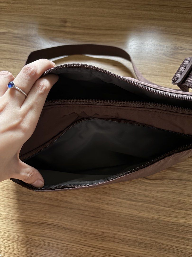 Uniqlo Two Way One Handle Bag (Category: Shoulder Bags) located in San Pedro. Submitted by nikkiabc.777 (Listing ID 1467403374, Image 3). Description: Uniqlo 2 Way One Handle Bag - color: brown - used twice only; no flaws - spacious, has many pockets and compartments - water repellent finish - can be unisex - can be bidy bag or shoulder bag; adjustable strap.
