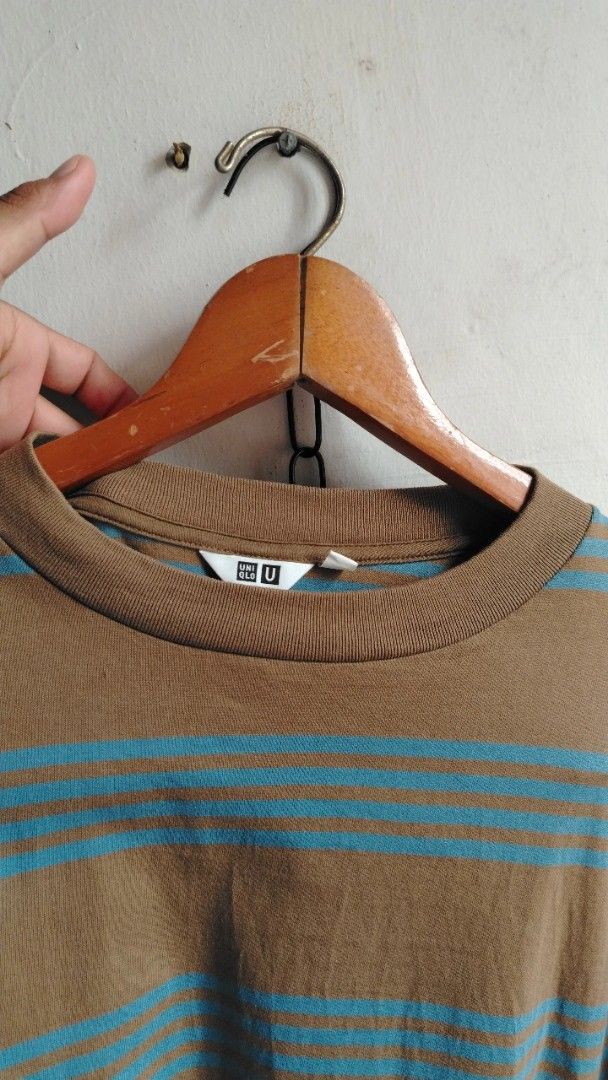 Uniqlo U Brown Blue Striped Tee (Category: Shirts) located in Cavite. Submitted by ukaynglahat (Listing ID 1467380422, Image 2). Description: - Brand/Collection: Uniqlo U - Size: L - Color/Pattern: Brown with blue horizontal stripes - Material: 100% cotton - Fit: Classic crew neck with short sleeves - Origin: Made in Vietnam - Condition: Clean, solid fabric with no obvious flaws.