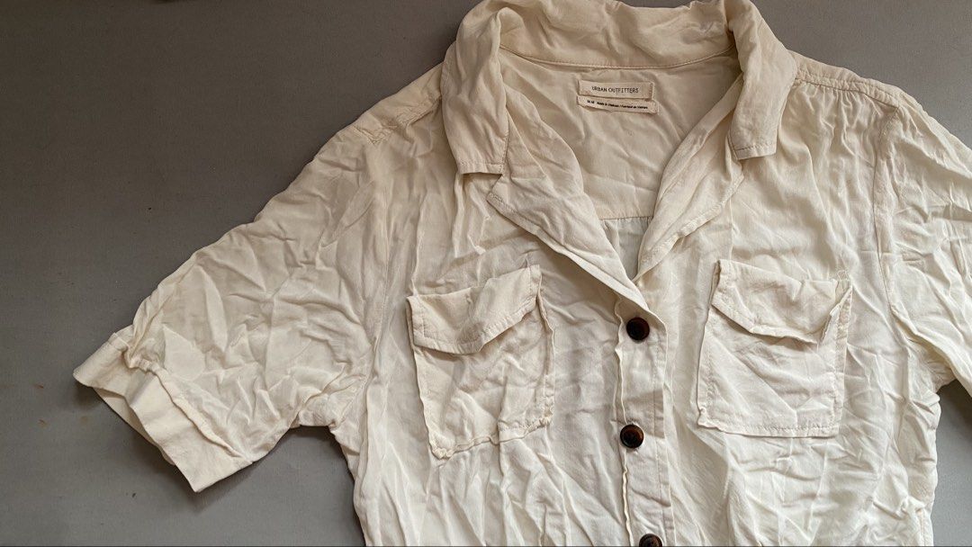 Urban Outfitters • Basic Polo Button Top (altered na po yung dulo) (Category: Blouses) located in Santa Rosa. Submitted by 07mkl (Listing ID 1467395127, Image 3). Description: Urban Outfitters • Basic Polo Button Top (altered na po yung dulo) • Condition: 9/10 • Flaws: none • Color: Beige/Cream ₱130✨ inalter ko na yung dulo, tinangal ko yung tale sa dulo, pinalitan ko ng button din..