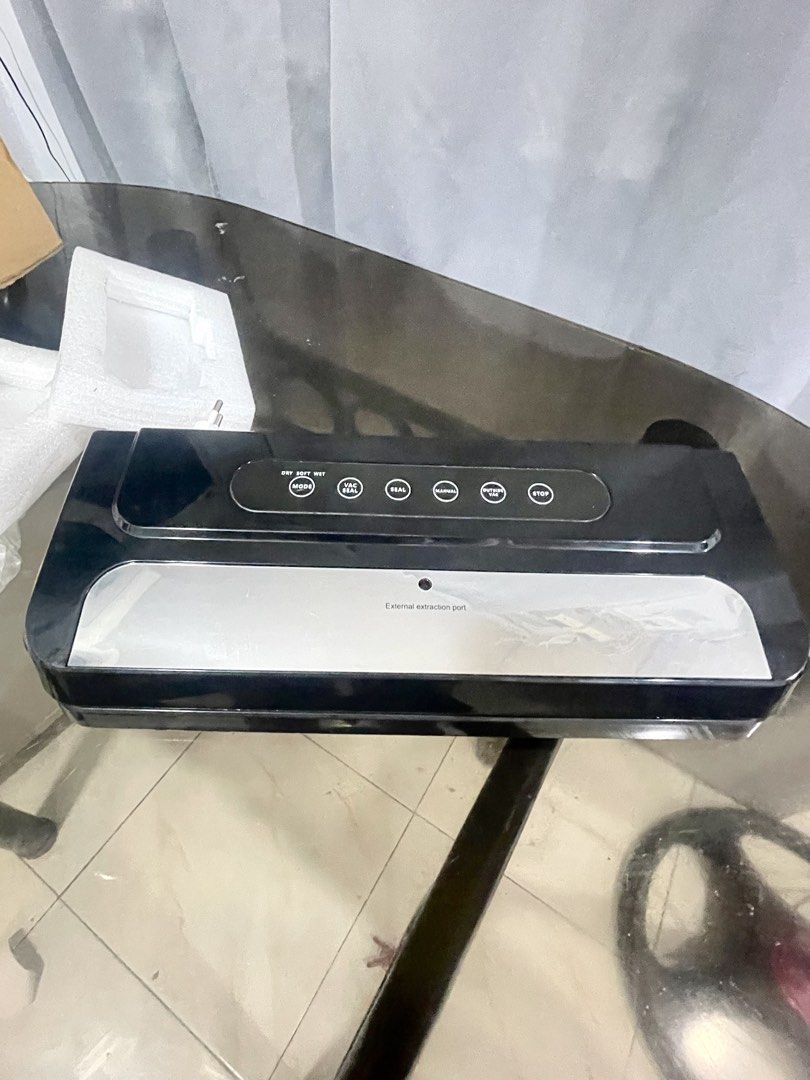 Vacuum Preservation Sealing Machine GW-01 (Category: Craft Supplies & Tools) located in Manila. Submitted by sheenasott40644 (Listing ID 1467365670, Image 1). Description: - Sleek black finish with a stylish silver accent panel - Multiple modes: Vac Seal, Seal, Manual, Outside Vac, and Stop - Keeps food fresh, flavorful, and airtight for longer - Complete set with original box, protective foam inserts, and instruction manual - Perfect for home me