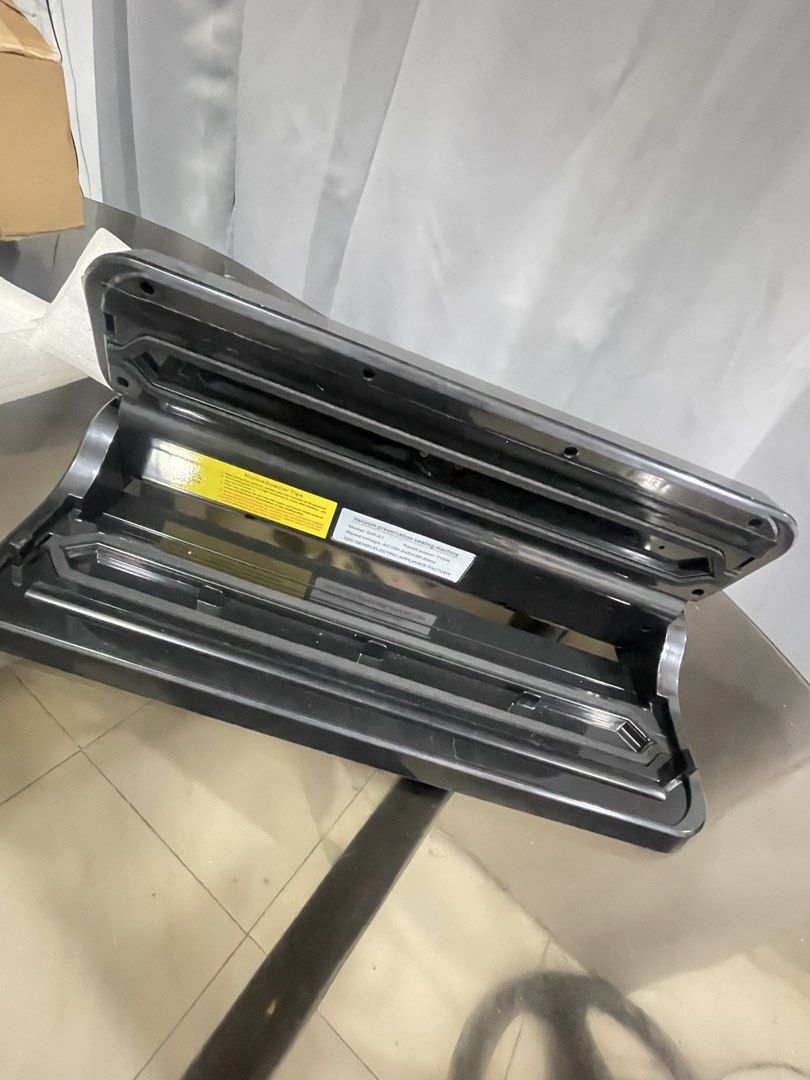 Vacuum Preservation Sealing Machine GW-01 (Category: Craft Supplies & Tools) located in Manila. Submitted by sheenasott40644 (Listing ID 1467365670, Image 2). Description: - Sleek black finish with a stylish silver accent panel - Multiple modes: Vac Seal, Seal, Manual, Outside Vac, and Stop - Keeps food fresh, flavorful, and airtight for longer - Complete set with original box, protective foam inserts, and instruction manual - Perfect for home me