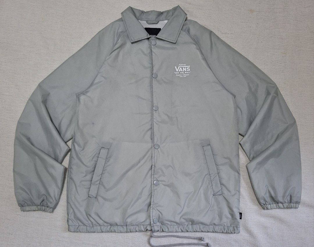 Vans Off The Wall Grey Coach Jacket (Category: Coats, Jackets and Outerwear) located in Danao, Cebu. Submitted by jthriftshop_ (Listing ID 1467416059, Image 1). Description: Vans Torrey Coach Windbreaker Jacket Size Medium on tag Best fit Large Width 22.8 Length 28.5 Snap Button Nylon Material Excellent Condition Color rate 9.5/10 Color may vary due to lighting Issue: Ink stain and yellow stain Ready to wear Location: Danao City, Cebu 📍 Price 66
