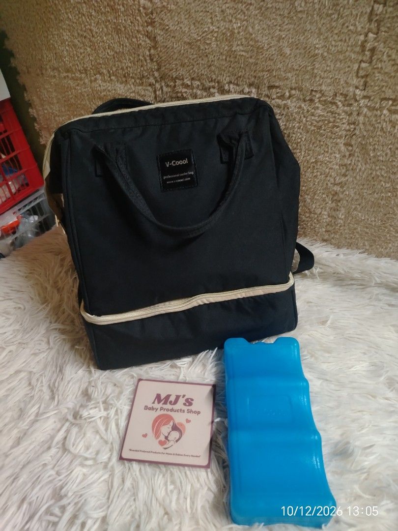V-Cool professional cooler bag with ice pack (Category: Tote Bags) located in Pulilan. Submitted by mjbabyproductsshop (Listing ID 1467479089, Image 1). Description: - Brand: V-Cool professional cooler bag - Color: Black - Purpose: Keeps milk bottles and pump gear cold on the go - Inclusions: Includes a blue contoured ice pack - Features: Dual zipper design opens wide for easy access - Capacity: Plenty of room for a breast pump or storage bags - 