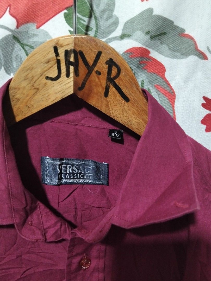 Versace Classic V2 Long Sleeve Button Down Shirt Maroon Size 15 (Category: Formal Shirts) located in Manila. Submitted by brarynpag30556 (Listing ID 1467472367, Image 2). Description: - Brand: Versace Classic V2 - Color: Maroon - Style: Long sleeve button-down shirt - Size: 15 (31-32) - Material: 65% cotton, 35% polyester blend - Details: Signature Versace-lettered branded buttons - Care: Warm wash, warm iron, dry cleanable (no bleach, no tumble 