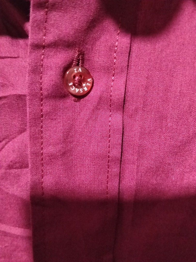 Versace Classic V2 Long Sleeve Button Down Shirt Maroon Size 15 (Category: Formal Shirts) located in Manila. Submitted by brarynpag30556 (Listing ID 1467472367, Image 3). Description: - Brand: Versace Classic V2 - Color: Maroon - Style: Long sleeve button-down shirt - Size: 15 (31-32) - Material: 65% cotton, 35% polyester blend - Details: Signature Versace-lettered branded buttons - Care: Warm wash, warm iron, dry cleanable (no bleach, no tumble 