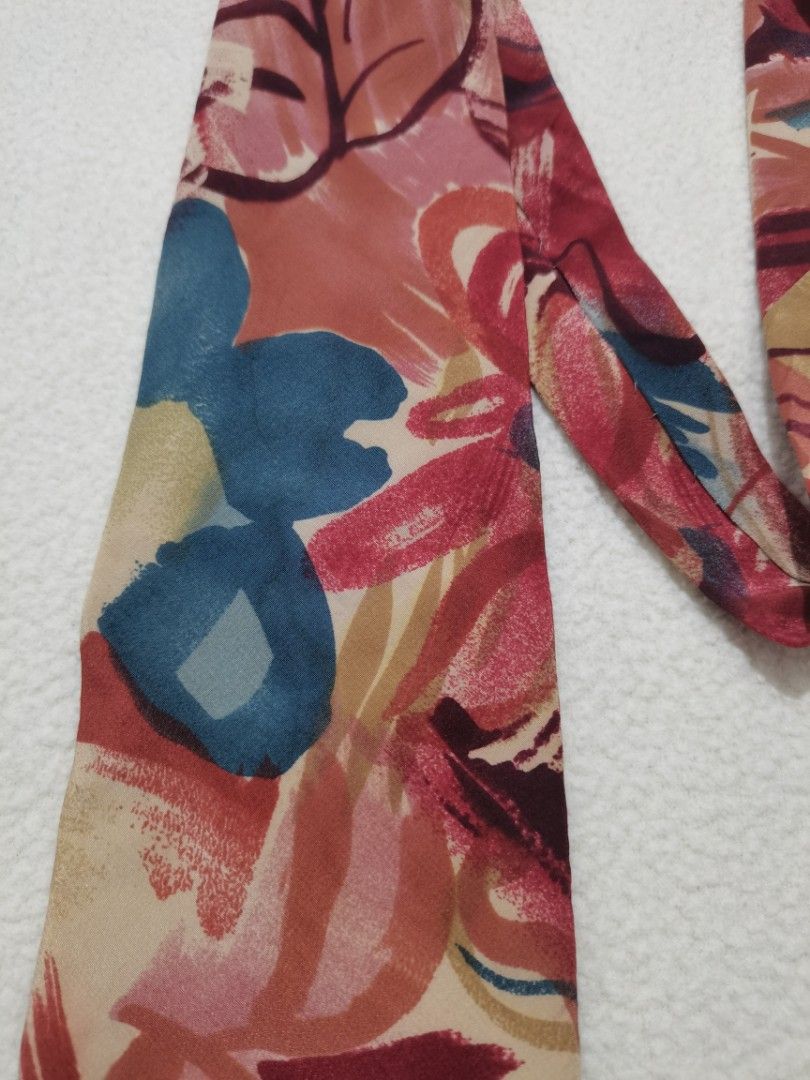 Via Veneto 100% Silk (Category: Ties) located in Santa Cruz. Submitted by oddpenguin-4575 (Listing ID 1467386031, Image 3). Description: • Brand: Via Veneto • Material: 100% Silk • Craftsmanship: Hand Tailored • Pattern: Abstract Floral / Watercolor Impressionist • Colors: Red, Pink, Slate Blue, Cream, Tan, Burgundy • Condition: Excellent vintage condition with with minor rips at blade part but barely noticeable. (Please see photos for close-up d