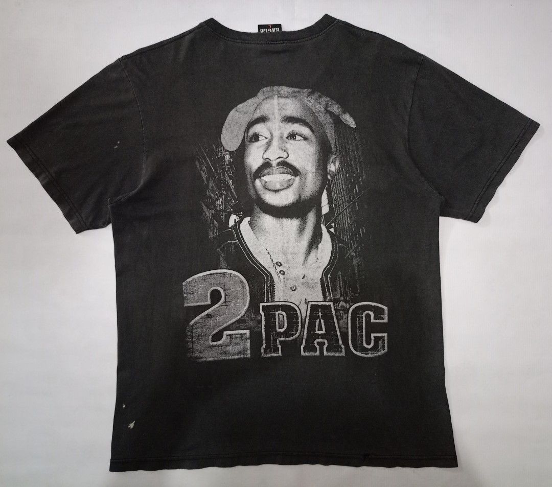 Vintage 2Pac Tupac Graphic Tee Hot Eagle Size L (Category: Tshirts & Polo Shirts ) located in Caloocan City. Submitted by grandturtle-371b8d (Listing ID 1467397244, Image 3). Description: - Item: Hot Eagle 2Pac Black T-Shirt - Size: L (Regular fit, short sleeve, standard crew neck) - Design: Big graphic print featuring Tupac and lettering on both front and back - Material: 100% cotton, made in Thailand - Style: Washed dark color look.