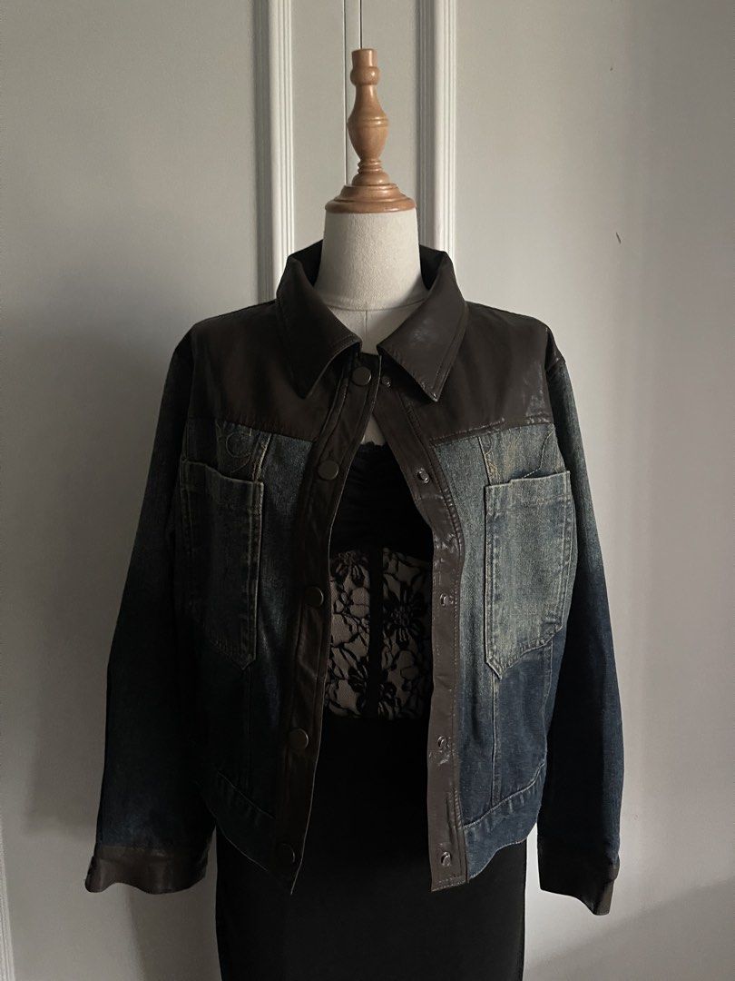 Vintage Brown Leather and Denim Panel Jacket (Category: Coats, Jackets and Outerwear) located in Cavite. Submitted by devilourea (Listing ID 1467483861, Image 2). Description: - Two-tone design combining dark brown leather on top with faded blue denim on the body and sleeves - Button-up front with secure snap closures and a classic pointed collar - Two functional chest pockets featuring subtle embroidery detail above the right pocket - Stylish cu