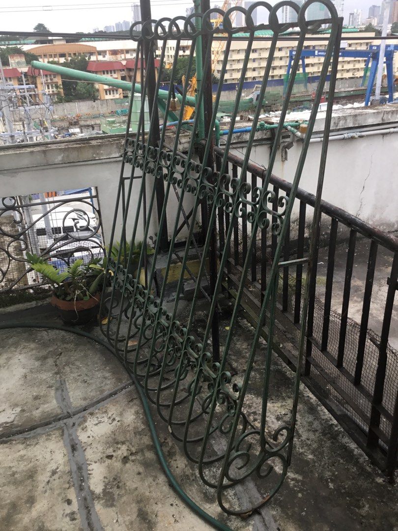Vintage Green Wrought Iron Security Gate Grille (Category: Locks, Doors & Gates) located in Manila. Submitted by roberto.enriquez (Listing ID 1467588791, Image 1). Description: - Green wrought iron security gate - Elegant scrollwork details on top and bottom - Heavy metal construction with lower wire mesh panel - Standard door or window width - Ideal for home security upgrades or vintage garden decor - Condition: Has surface weathering and rust s