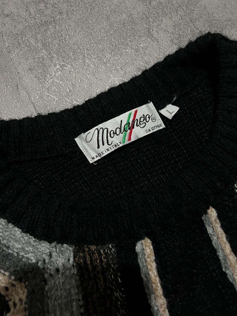Vintage Modango Made In Italy Zigzag Pattern Knit Sweater Size L (Category: Coats, Jackets and Outerwear) located in Batangas. Submitted by yuellll (Listing ID 1467540422, Image 3). Description: MODANGO 3d knit sweater 🚨Please check all details before commenting. 📌 ITEM DETAILS (boxy fit) Width:27 Length:27 Color Rate:10/10 Condition:10/10 Issue: N/A - Brand: Modango (Made in Italy) - Size: Large - Design: Black base with grey, blue, and brown 