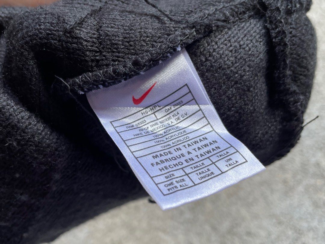 Vintage Nike Black Beanie Hat (Category: Caps & Hats) located in Siniloan. Submitted by rethr1ft (Listing ID 1467420164, Image 2). Description: - Brand: Nike - Color: Classic black with white swoosh embroidery and stripe detail - Material: 100% acrylic (warm and cozy) - Origin: Made in Taiwan - Size: One size fits all - Condition: Great for cold weather or everyday streetwear.