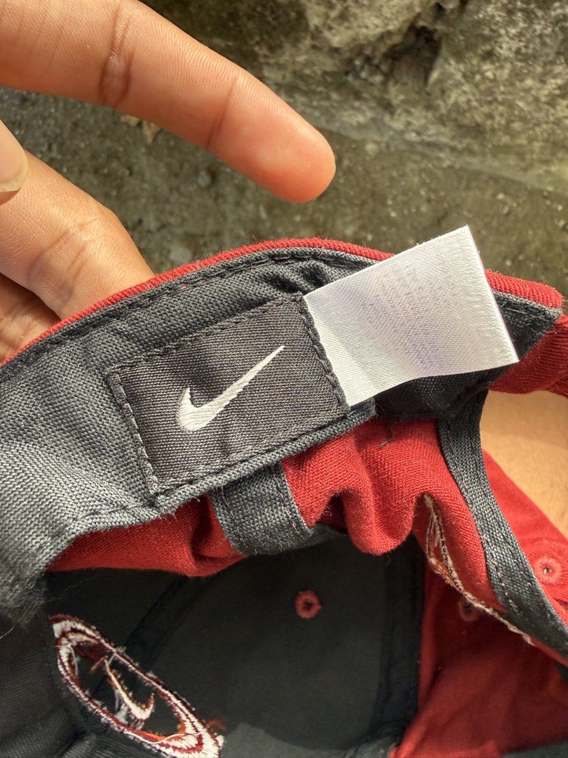 Vintage Nike Maroon Cap (Category: Caps & Hats) located in Burgos, Ilocos Norte. Submitted by copthrift (Listing ID 1467371743, Image 3). Description: - Brand: Nike - Style: Classic retro dad hat - Color: Maroon with dark grey inner lining - Details: Embroidered Nike logo on the front and back - Fit: Adjustable strap with a metal buckle.