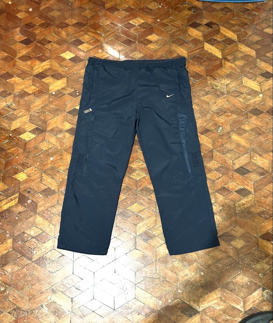 Vintage Nike Trackpants (Category: Trousers) located in Manila. Submitted by oloip.thrift (Listing ID 1467527961, Image 1). Description: Size: XXL Dimes: 40/40 Leg opening: 9 Good Condition Color way: Navy blue.