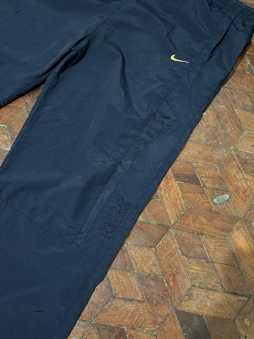 Vintage Nike Trackpants (Category: Trousers) located in Manila. Submitted by oloip.thrift (Listing ID 1467527961, Image 3). Description: Size: XXL Dimes: 40/40 Leg opening: 9 Good Condition Color way: Navy blue.